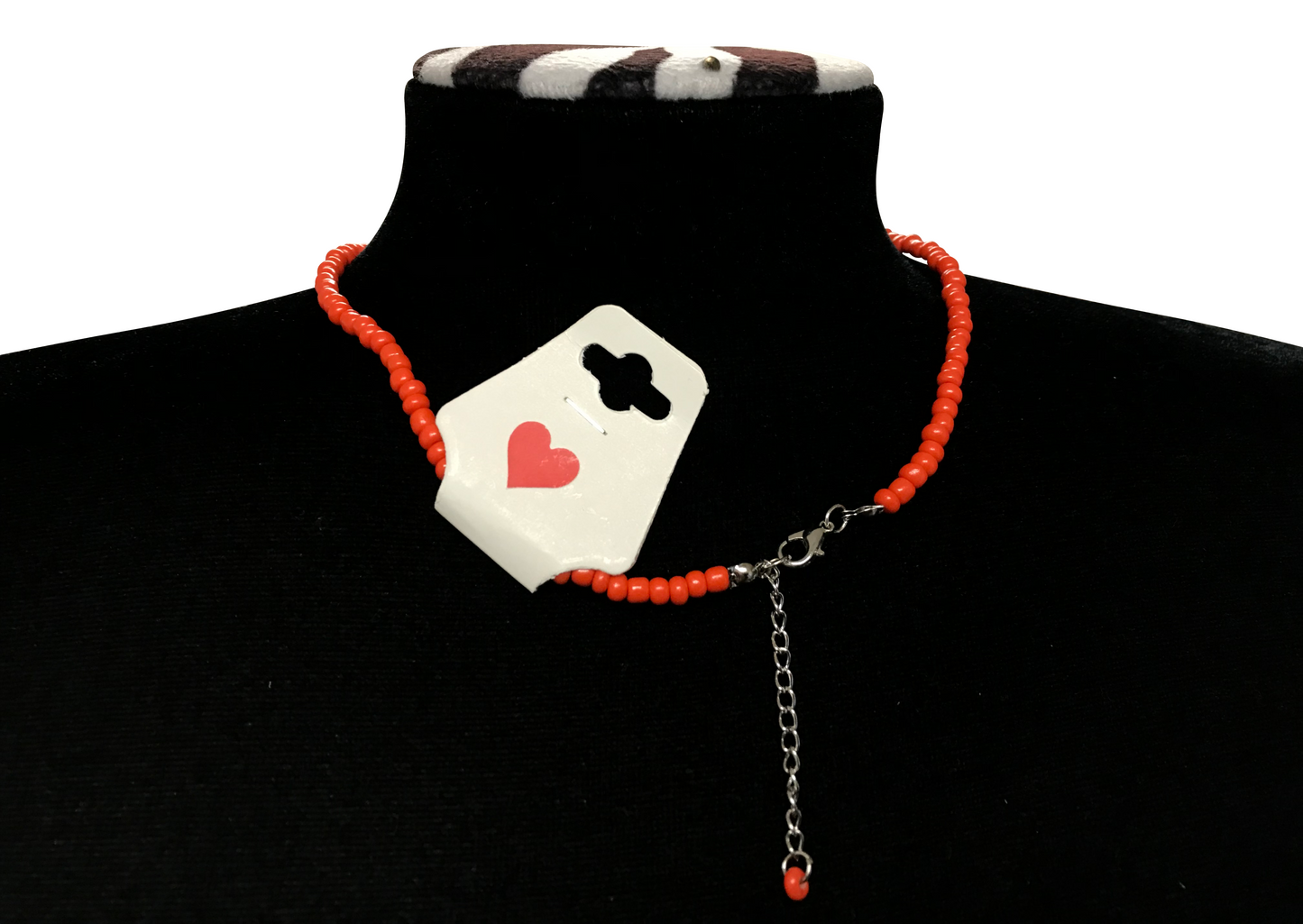 Necklace with a heart and clover design on a black turtleneck