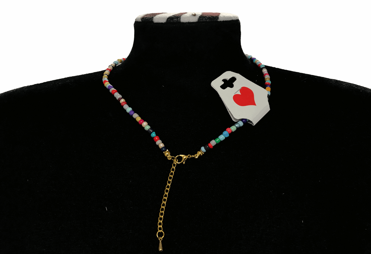 Back part of a colorful beaded necklace worn on a black mannequin