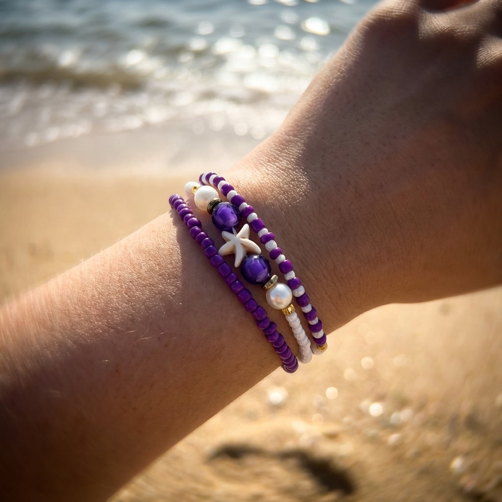 purple handmade beaded bracelets on a beach