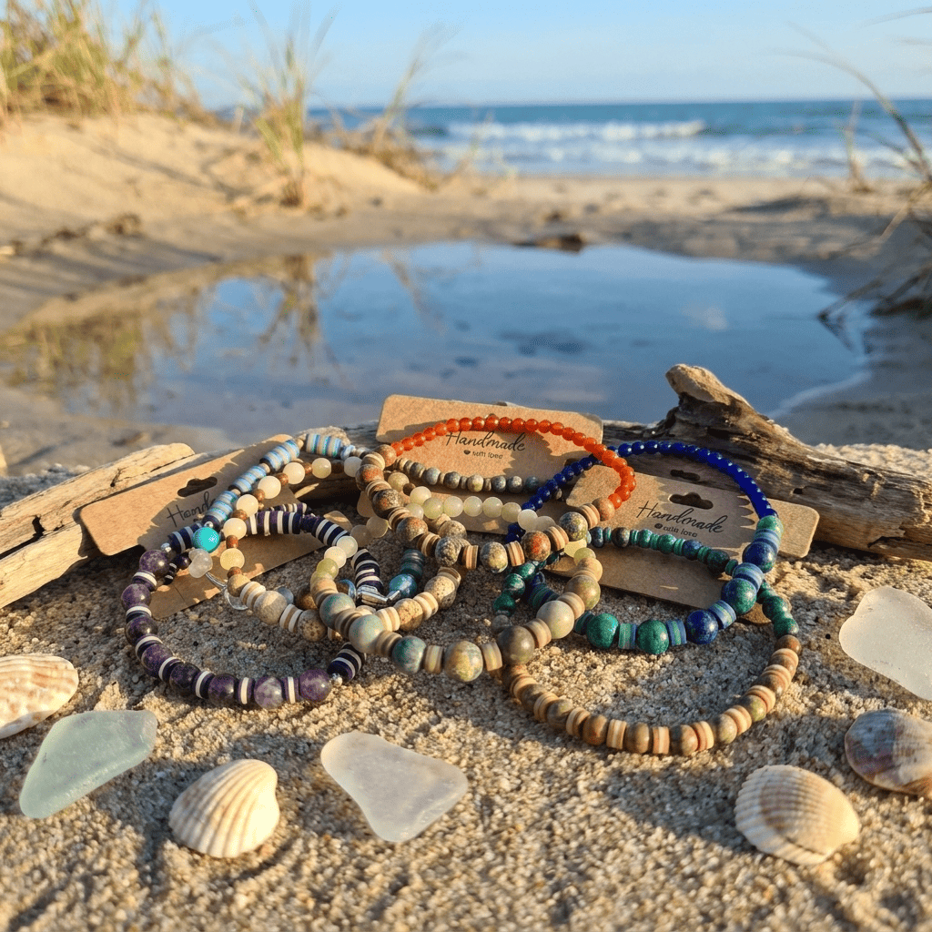 Handmade beaded bracelet collection with natural stone beads on a sea side