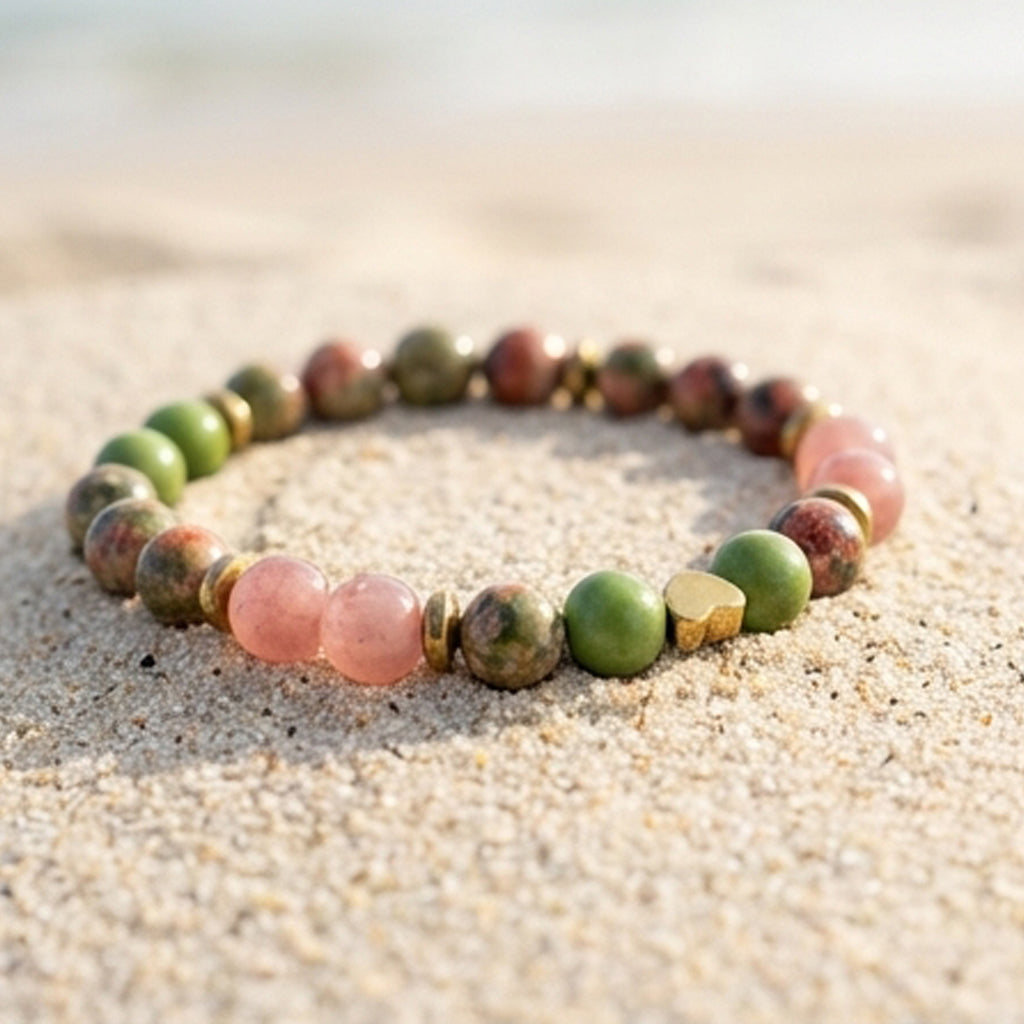 Multicolored beaded bracelet on a sandy surface