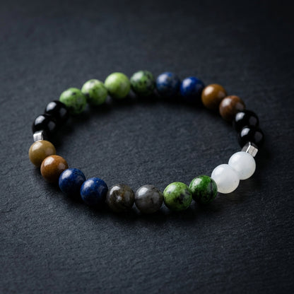 Multicolored beaded bracelet on a dark textured surface