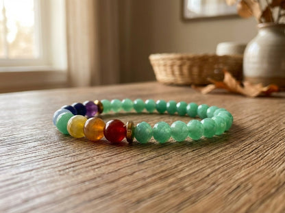 Green and Colorful beaded bracelet on a wooden surface with a blurred indoor background