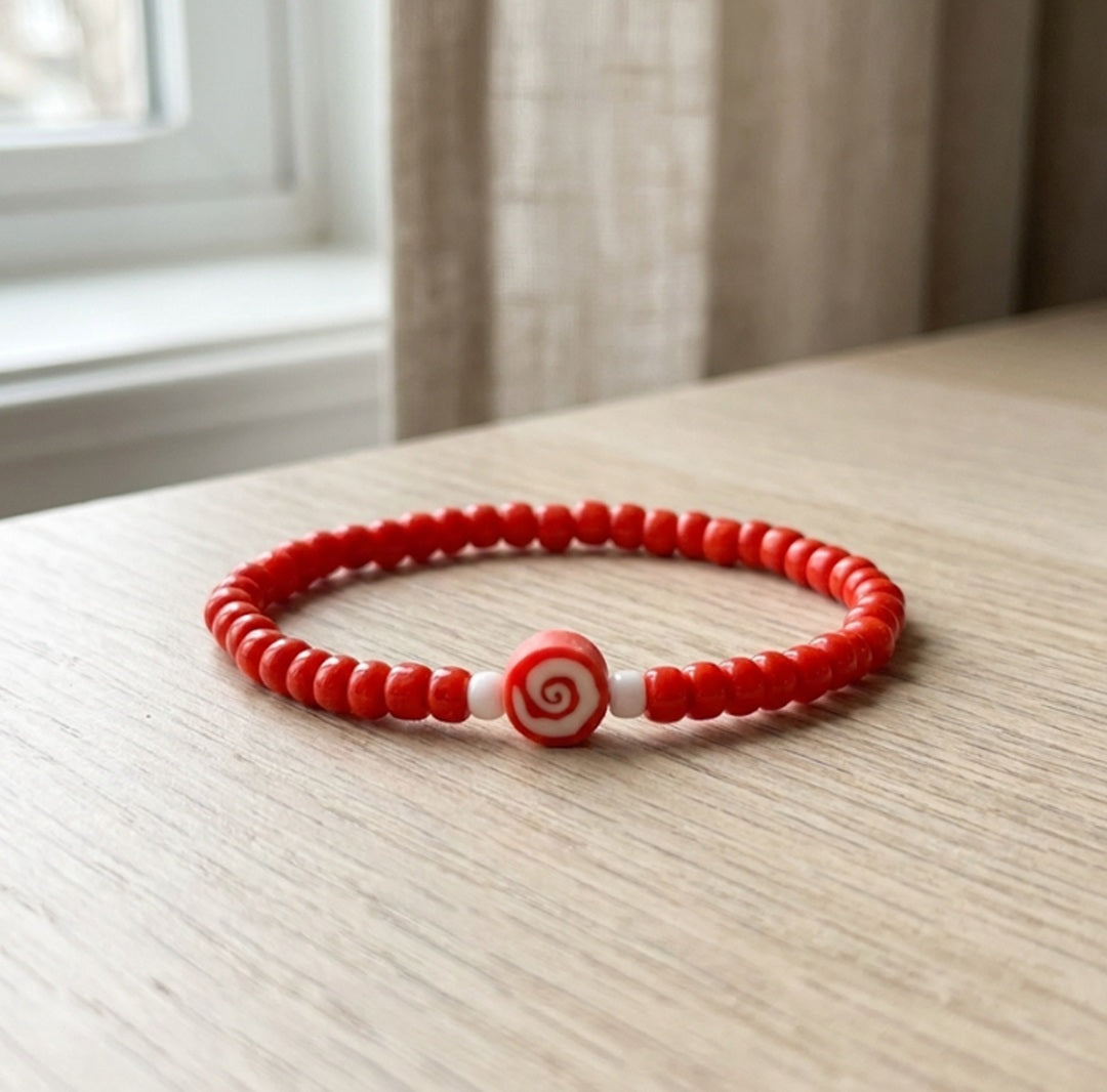 Handmade Red Beaded Bracelet with Spiral Charm – Elastic Jewelry with White Accent Beads