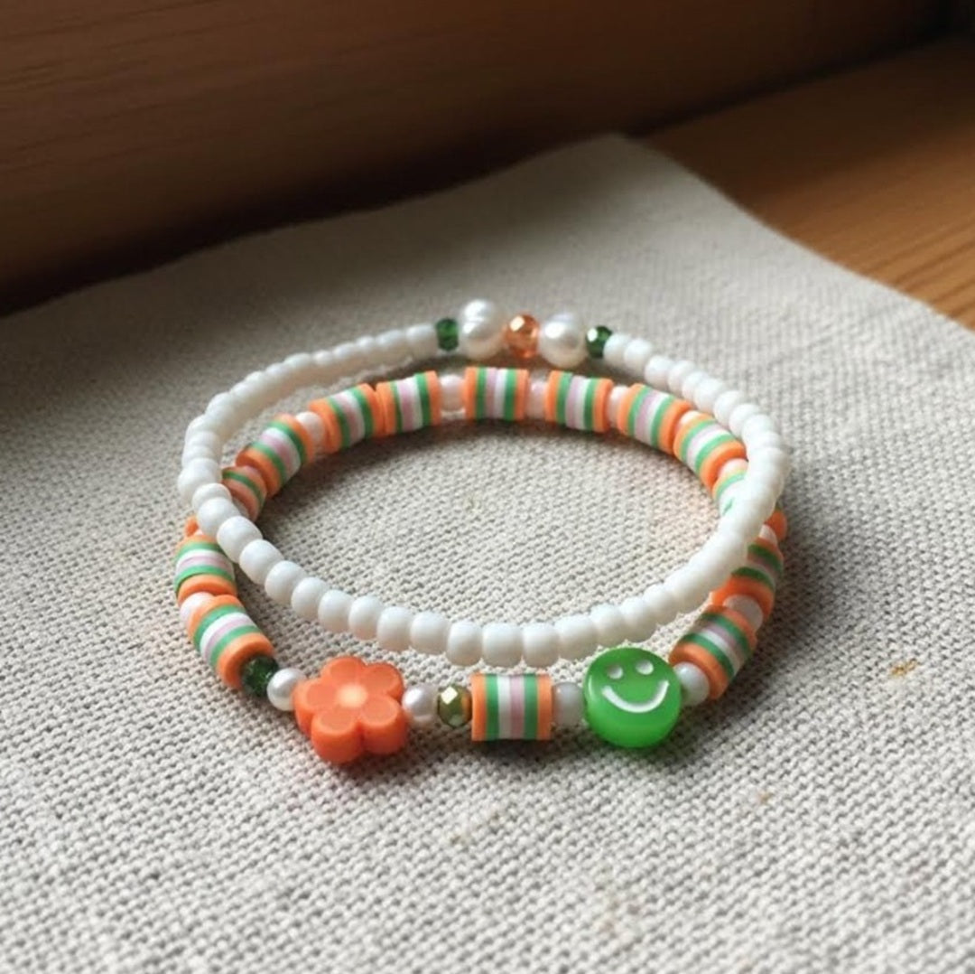 Handmade 2-Piece Bracelet Set with White Beads, Orange & Green Accents, Flower & Smiley Charms – Gift Jewelry, Boho Chic Style
