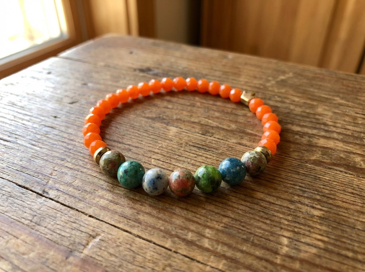 Handmade Orange and multicolor bracelet on top of a wooden table