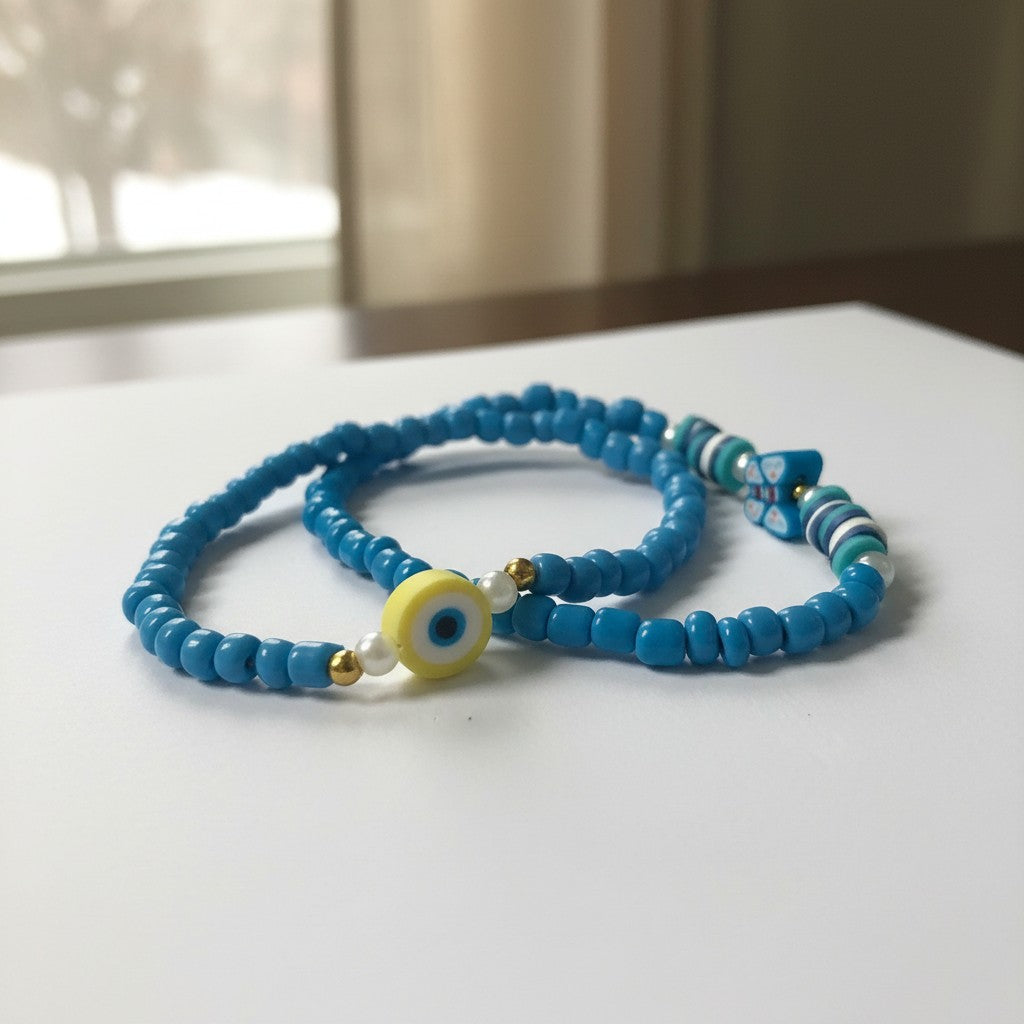 Blue beaded necklace with a yellow evil eye bead on a white surface