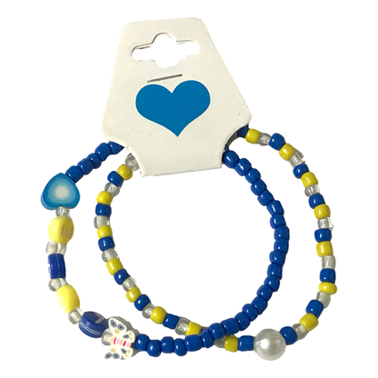 Set of beaded bracelets with blue, yellow, and silver beads on a card with a blue heart design.