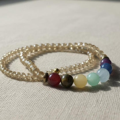 Multicolored beaded bracelet on a light fabric background