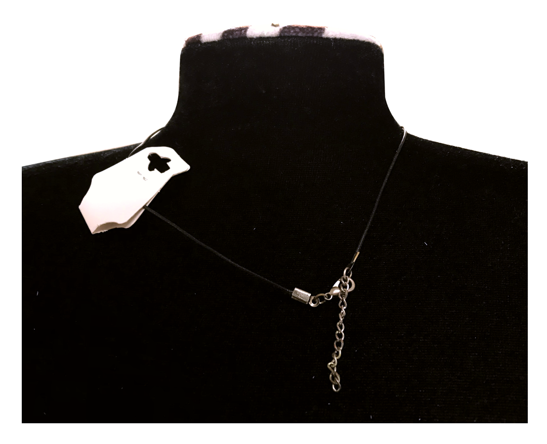 Necklace with a chain detail on a black mannequin bust.