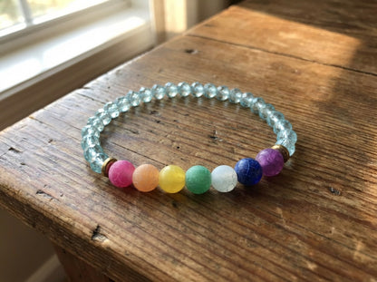 Multicolored beaded bracelet on a wooden surface
