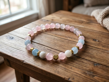 Multicolored beaded bracelet on a wooden table with a blurred indoor background