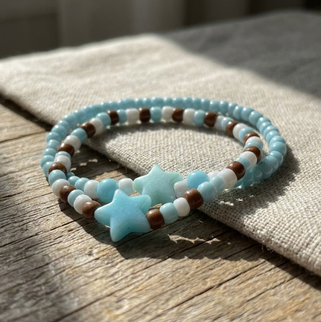 Handmade Beaded Friendship Bracelet – Light Blue & White Beads with Brown Accents, Two Blue Star Beads, Playful Gift for Kids/Teens