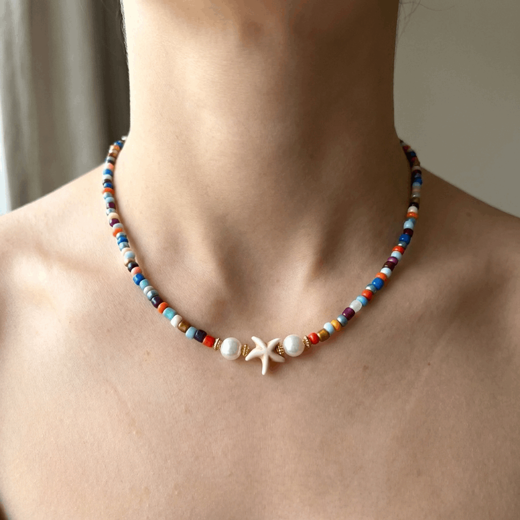 Handmade Beaded Multicolor Necklace with Starfish Charm and Faux Pearls on a woman's neck