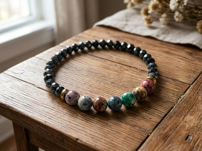 Multicolored beaded necklace on a wooden surface with natural light