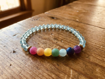 Multicolored beaded bracelet on a wooden surface