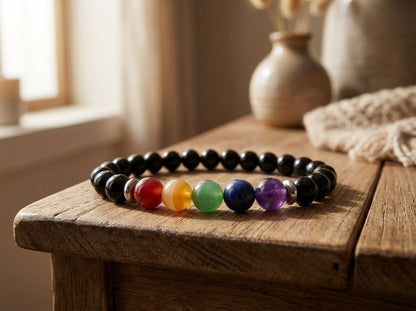 Colorful beaded bracelet on a wooden surface with a soft, natural light background.