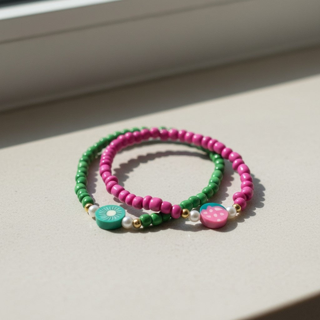 Two colorful beaded bracelets on a light surface