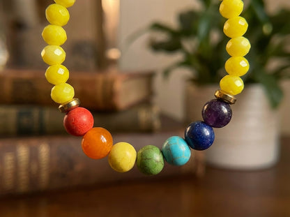 Colorful beaded bracelet on a wooden surface with a blurred background