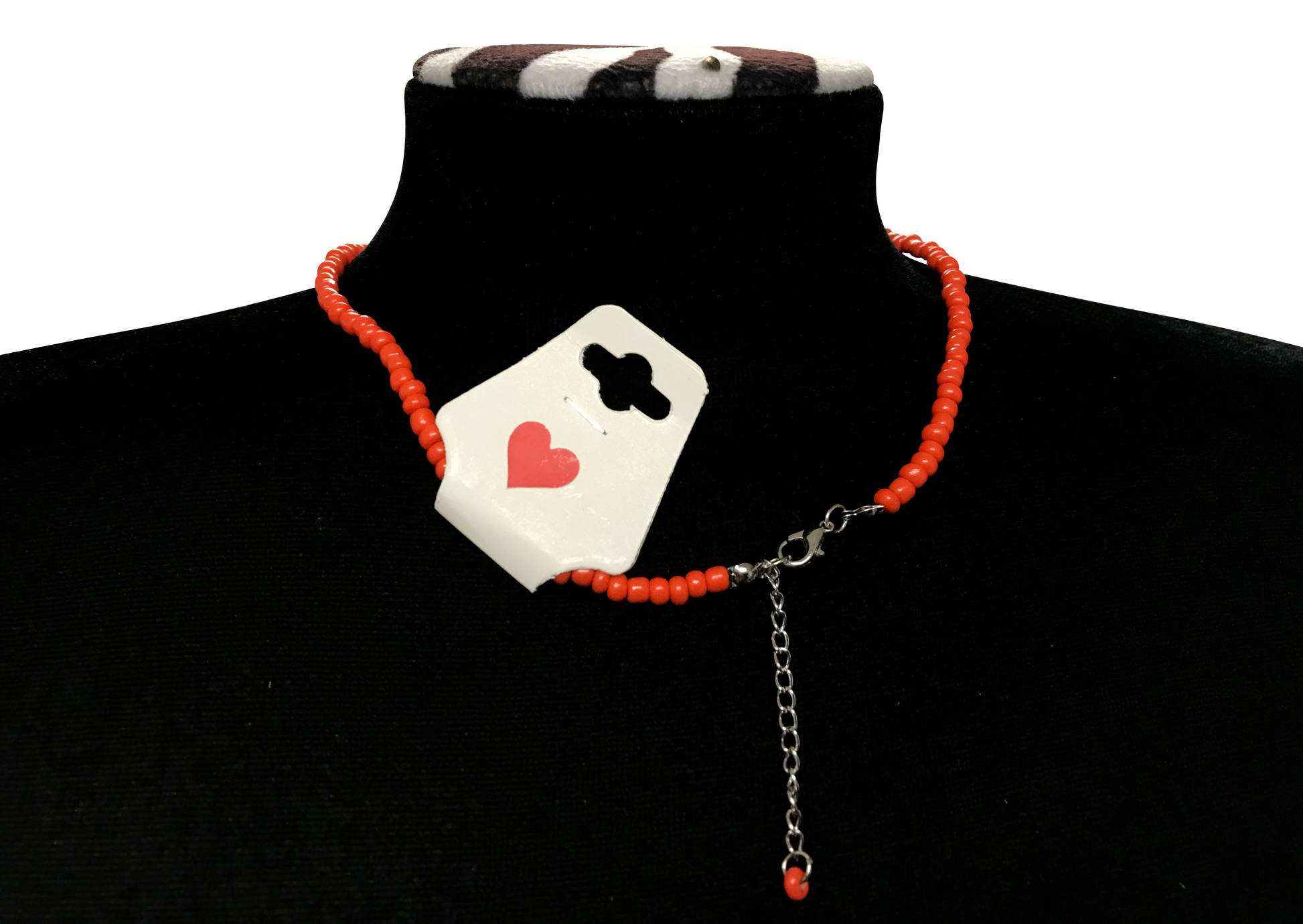 Necklace with a heart and clover design on a black turtleneck