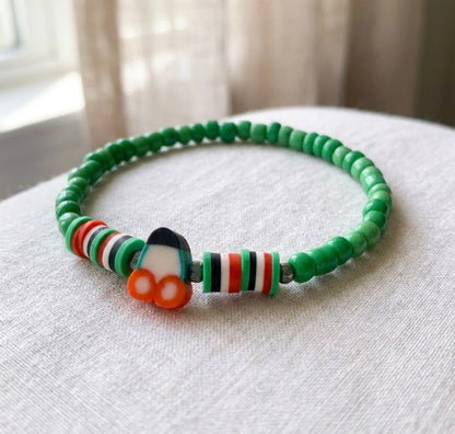 Boho Beaded Bracelet with Cherry Charm – Green Beads & Red-White-Green Accents, Handmade Elastic Jewelry