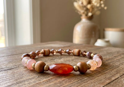 Handmade Beaded Bracelet with Warm Brown, Pink & Red Tones and Red Gemstone-Style Centerpiece – Earthy Autumn Jewelry