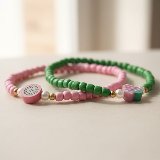 Two colorful beaded bracelets on a light surface with a blurred background