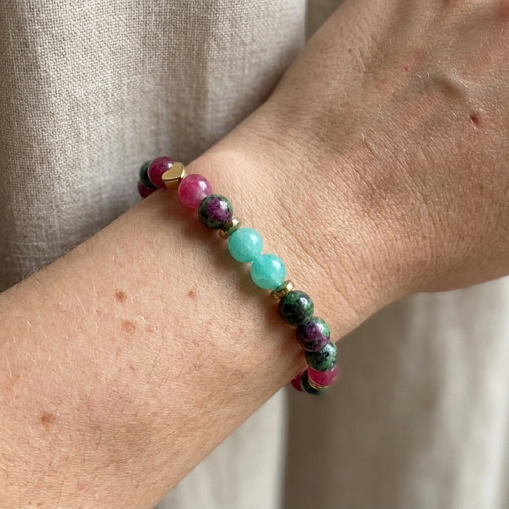Multicolored beaded bracelet on a wrist with a neutral background